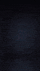 a black background with a splash of gold in the middle