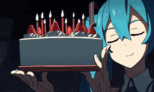 a girl with blue hair holds a cake with candles on it