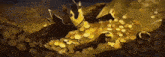 a pile of gold coins with a crown on top of them .