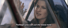 a woman is sitting in a car with the words perhaps you can cut me loose now