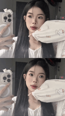 a girl taking a picture of herself in a mirror