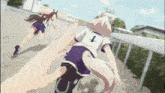 a girl with the number 1 on her back is running next to a horse