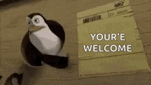 a penguin is standing next to an envelope that says `` your e welcome '' .