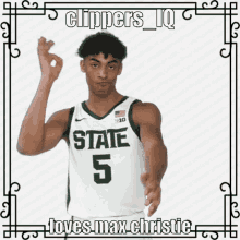 a basketball player wearing a state 5 jersey giving the ok sign
