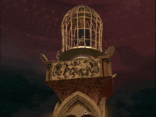 a bird cage with a person inside of it