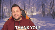 a man is sitting in a chair and saying thank you
