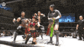 a group of wrestlers are posing for a picture with a #ddpro logo in the corner