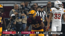 a football game is being played between iowa state and arizona