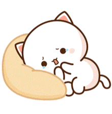 a cartoon cat is laying on a pillow with a sad look on its face .