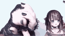 a girl with black nails is holding a black lace glove