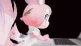 a pink stuffed animal is sitting on a laptop keyboard
