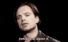 a close up of a man 's face with the words `` whispers damn it '' written next to him .