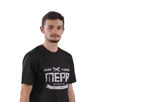 a man wearing a black t-shirt that says " we run " is pointing to the right