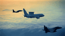 two fighter jets and a military plane are flying in the sky