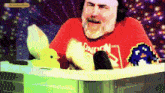 a man in a red london shirt is sitting in a hot tub