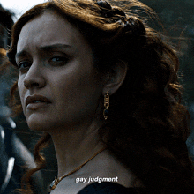 a close up of a woman 's face with the words gay judgment above her