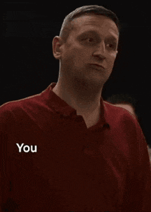 a man in a red shirt is saying that he can 't do anything when someone says shut up