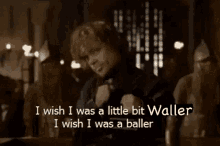 a man is standing in front of a crowd and says i wish i was a baller