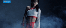 a girl in a white top is standing in front of a blue sign that says lip front works