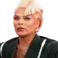a woman with blonde hair is wearing a black and white jacket and earrings