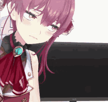 a girl with purple hair is looking at a monitor