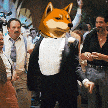 a man in a tuxedo with a dog 's head on his head