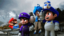 a group of cartoon characters including mario and wario are sitting on a rock wall