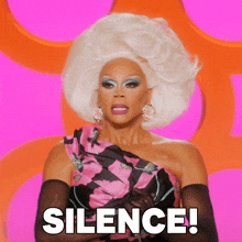 a drag queen says silence in a pink and orange background