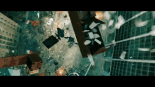 a large explosion in a city with a lot of papers falling from the sky
