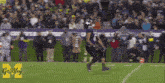 a football player with the number 6 on his jersey is running on the field .