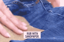 sandpaper rub with sandpaper jeans