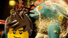 a lego character is standing next to a giant green monster