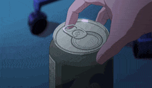 a person is opening a soda can with a ring that says ' o ' on it