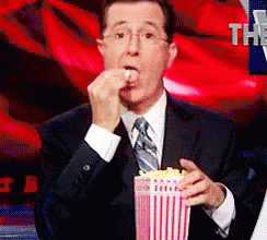 colbert stephen eating popcorn just here to watch