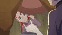a little girl with red hair and blue eyes is looking at something