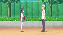 a boy and a girl standing next to each other
