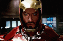 a close up of a man in a superhero suit saying hello mouse