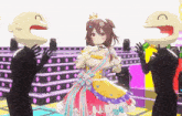 a girl with a crown on her head is standing on a stage surrounded by cartoon characters with their mouths open .