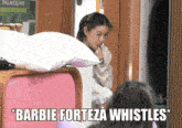 a barbie forteza whistle is being blown by a young girl