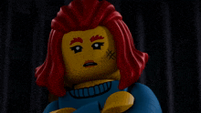 a lego figure with red hair has a cross on her face