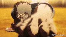 a man in a karate uniform is fighting another man in a karate match .