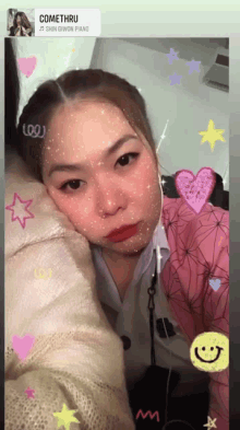 a girl taking a selfie with a comethru sticker on the bottom