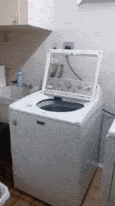 a white washer and dryer with the door open
