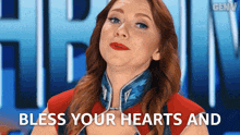 a woman says bless your hearts and is wearing a red shirt
