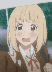 a girl with short blonde hair holding an umbrella