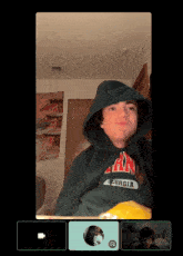 a person wearing a georgia sweatshirt is on a video call with another person