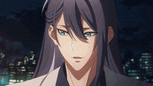 a close up of a person 's face with long hair and blue eyes