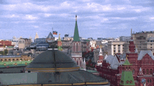 an aerial view of a city with a flag on top of a building