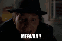 a man wearing a hat and a leather jacket says megvan !