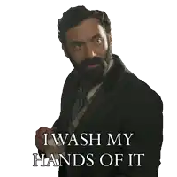 a man with a beard holds a cup of coffee and says i wash my hands of it